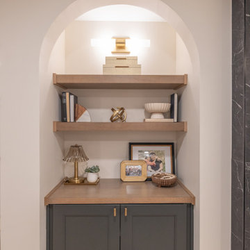 Warm & Inviting Basement Retreat with Custom Bar + Entertainment Center