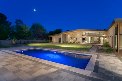 Inspiration for a large contemporary one-story mixed siding house exterior remodel in Orange County