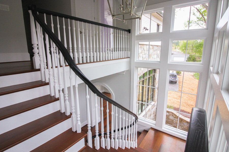 Powerful Impression by Floating Staircase in Suburban Foyer