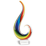 Badash Crystals - Rainbow Note 16" - Rainbow Note  Murano style Art Glass 16" Centerpiece is plethora of color flowing onto your home. Rich Rainbow colors reach out to the sky. A simple clean attractive shape embellished with rich color make this unique décor accent a winner.  The rainbow is a comprised of seven different colors. Each of these colors is vibrant and beautiful, and each one is different than the next. This conveys a beautiful message of inclusiveness and cohesion. It demonstrates how beautiful diversity can be. Art glass is a blend of many colors of glass and it is completely normal to have air bubbles appear in the glass. Colors may also vary slightly from piece to piece making each one a unique work of art.