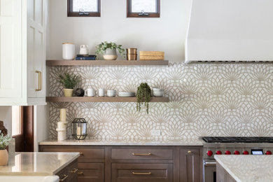 Large tuscan u-shaped travertine floor, beige floor and exposed beam eat-in kitchen photo in Orange County with a farmhouse sink, shaker cabinets, white cabinets, quartzite countertops, beige backsplash, mosaic tile backsplash, stainless steel appliances, an island and beige countertops