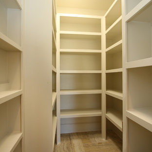 Large contemporary kitchen pantry designs - Large trendy limestone floor and beige floor kitchen pantry photo in Houston with a farmhouse sink, raised-panel cabinets, granite countertops, beige backsplash, ceramic backsplash, stainless steel appliances and an island