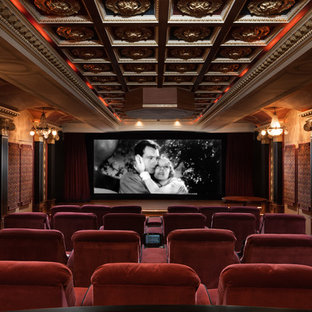 Example of a huge classic enclosed carpeted home theater design in Birmingham with beige walls and a projector screen