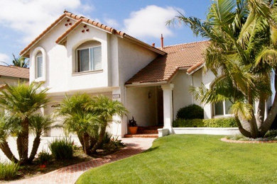 Example of a large two-story exterior home design in San Diego