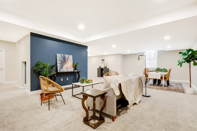 Large trendy look-out carpeted and gray floor basement photo in Other with beige walls