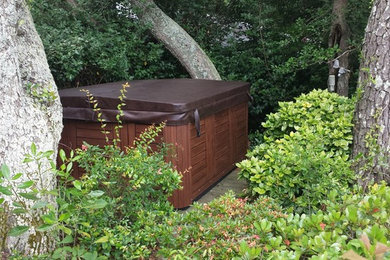 Hot tub - mid-sized traditional backyard rectangular aboveground hot tub idea in Other