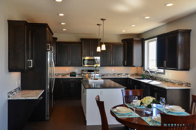 Eat-in kitchen - mid-sized contemporary u-shaped eat-in kitchen idea in Calgary with a drop-in sink, shaker cabinets, dark wood cabinets, quartzite countertops, multicolored backsplash, matchstick tile backsplash, stainless steel appliances and an island