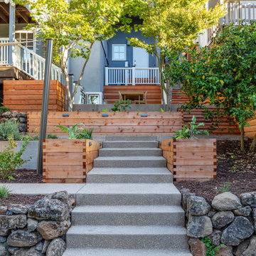 Concrete steps with integral pebble aggregate and dry stacked rock walls, custom