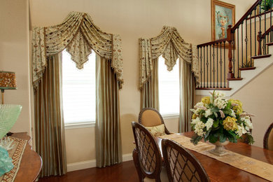 Mid-sized elegant dark wood floor kitchen/dining room combo photo in Miami with beige walls and no fireplace