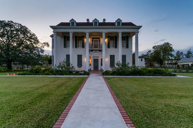 Large elegant white two-story wood exterior home photo in Austin with a shingle roof