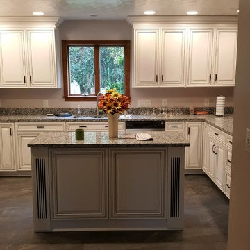 kitchen remodel--white with black glaze cabinets, granite countertop, porcelain