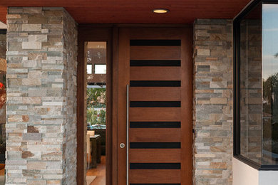 Mid-sized trendy front porch idea in San Diego with decking and a roof extension