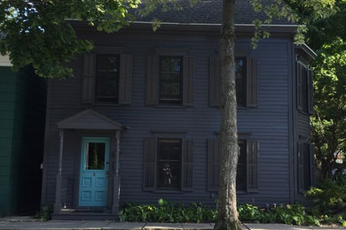 Mid-sized eclectic black two-story wood house exterior idea in New York