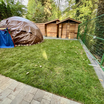 Sweat lodge from the edge of the pergola with utility support structures beyond