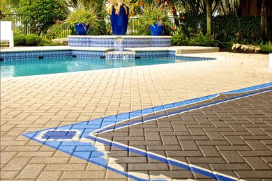 Photo of a small mediterranean patio in Miami with concrete pavers and no cover.