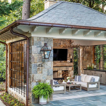 Traditional Pool House with Stone Facade