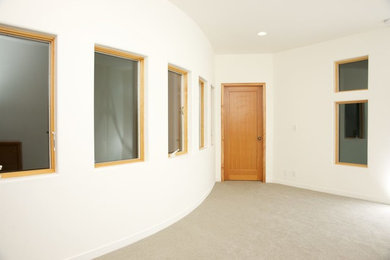 Inspiration for a mid-sized timeless carpeted and gray floor hallway remodel in Chicago with white walls