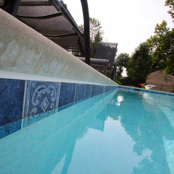 Classic Rectangle style in-ground salt water pool with diving board