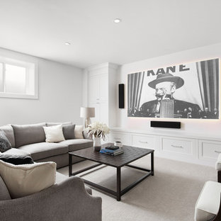 Inspiration for a mid-sized scandinavian enclosed carpeted and gray floor home theater remodel in Calgary with white walls and a wall-mounted tv