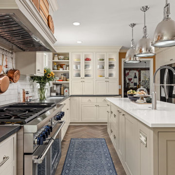 Warm Traditional Kitchen Remodel with Cream Cabinets & Herringbone Floors