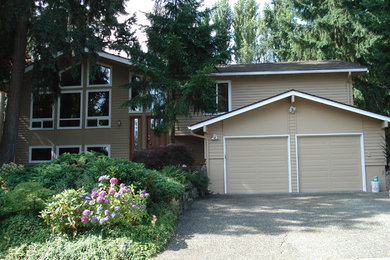 Example of a mid-sized classic brown two-story wood gable roof design in Seattle