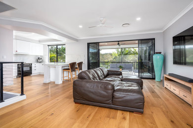 This is an example of a contemporary living room in Gold Coast - Tweed.