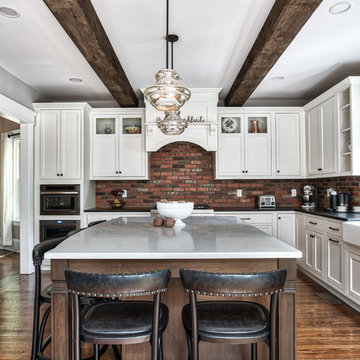 Large Kitchen Island With a View of the Stove
