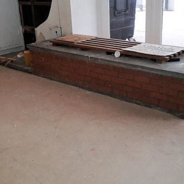 Installing Wall Cladding and Concrete Floor Tiles in Hide Tower