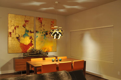Mid-sized trendy medium tone wood floor kitchen/dining room combo photo in Houston with beige walls and no fireplace