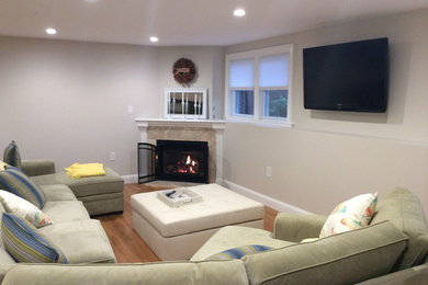 Example of a classic family room design in Boston