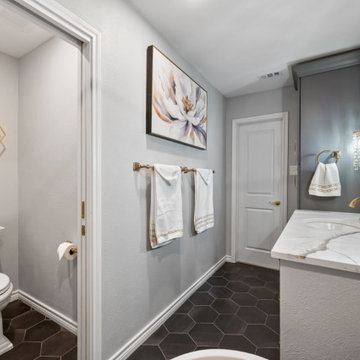 Elegant Bathroom Vanity with Crystal Sconces and Quartz Countertop