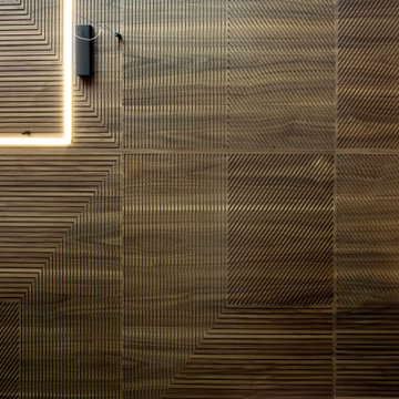 Dettaglio lavorazione boiserie a parete in legno