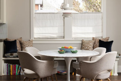 Inspiration for an eclectic dark wood floor and brown floor breakfast nook remodel in Salt Lake City with beige walls