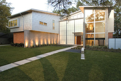 Example of a large trendy two-story exterior home design in Houston