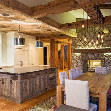 Reclaimed Wood Ceiling Paneling, Timbers, and Mantel in a Modern Farmhouse Great