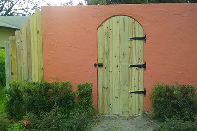 Example of a mid-sized classic backyard concrete paver patio design in Orlando with no cover