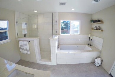 Mid-sized trendy master white tile and ceramic tile gray floor bathroom photo in Other with beige walls, an undermount sink, shaker cabinets and white cabinets
