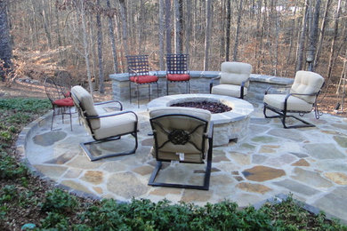 Mid-sized traditional backyard patio in Birmingham with a fire feature and natural stone pavers.