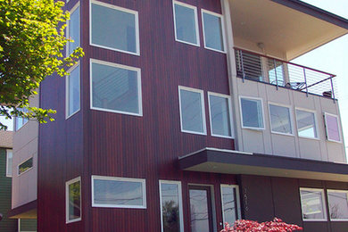 Large minimalist beige two-story vinyl exterior home photo in Seattle