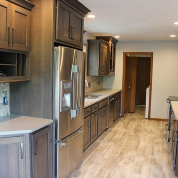 Bettendorf, IA- Gorgeous Galley Kitchen Remodel With Gray Stain and Quartz Tops