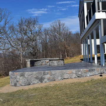 Stamped Concrete with Stone fire pit and stone wall