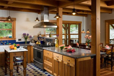 Eat-in kitchen - mid-sized farmhouse u-shaped eat-in kitchen idea in Other with a farmhouse sink, louvered cabinets, light wood cabinets, stainless steel appliances and an island