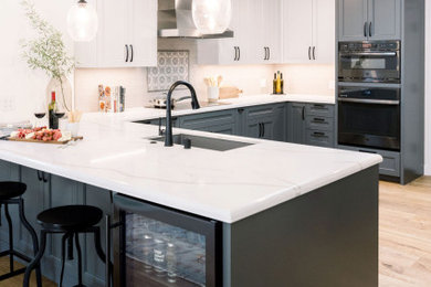 Inspiration for a transitional beige floor kitchen remodel in San Francisco with black appliances and white countertops