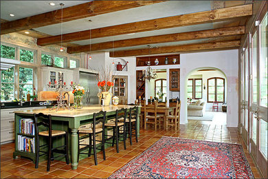 Large tuscan u-shaped concrete floor open concept kitchen photo in DC Metro with a drop-in sink, raised-panel cabinets, white cabinets, granite countertops, multicolored backsplash, stainless steel appliances and an island