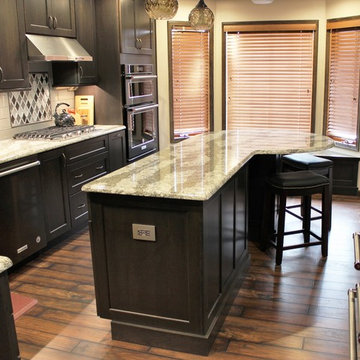 DuraSupreme Peppercorn Kitchen With Cambria Tops and Black Stainless Appliances