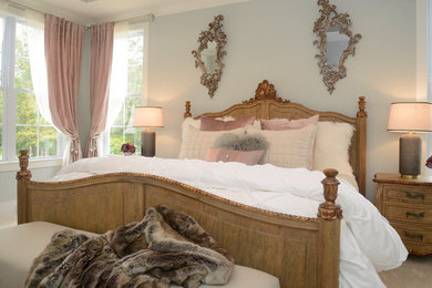 Example of a mid-sized french country master carpeted bedroom design in Raleigh with gray walls and no fireplace