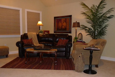 This is an example of a small traditional enclosed family room in Nashville with beige walls, no tv and carpet.