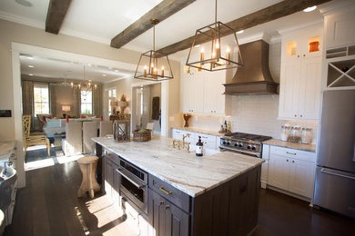 Inspiration for a large cottage single-wall dark wood floor and brown floor kitchen pantry remodel in Atlanta with raised-panel cabinets, white cabinets, granite countertops, an island, a farmhouse sink, gray backsplash, subway tile backsplash and stainless steel appliances