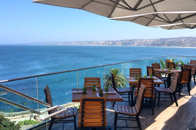 Example of a mid-sized beach style backyard patio design in San Diego