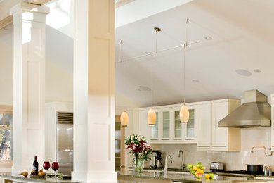 Huge transitional u-shaped light wood floor eat-in kitchen photo in Denver with shaker cabinets, white cabinets, stainless steel appliances and two islands